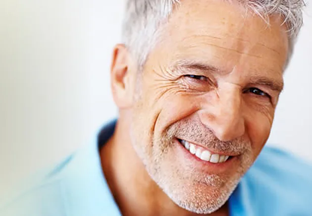 A smiling patient with a bright, natural-looking smile